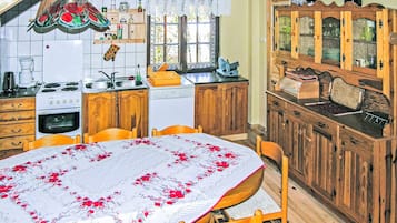 Fridge, stovetop, dishwasher, coffee/tea maker