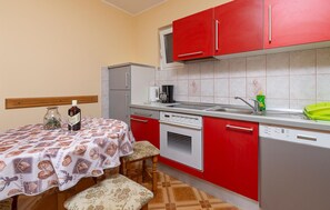 Fridge, stovetop, dishwasher, coffee/tea maker
