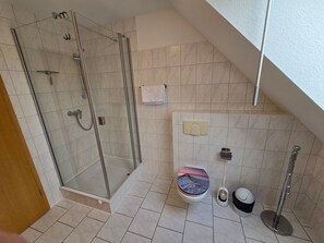 Shower, hair dryer, towels, soap