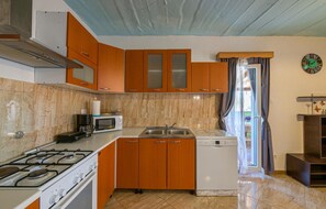 Fridge, stovetop, dishwasher, coffee/tea maker