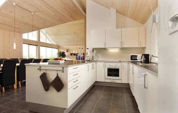 Fridge, stovetop, dishwasher, coffee/tea maker