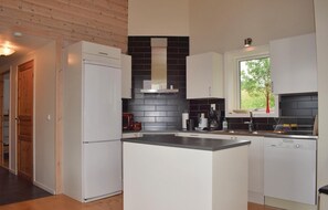 Fridge, stovetop, dishwasher, coffee/tea maker