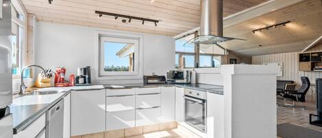 Fridge, stovetop, dishwasher, coffee/tea maker