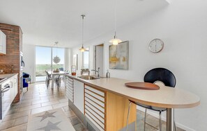 Fridge, stovetop, dishwasher, coffee/tea maker