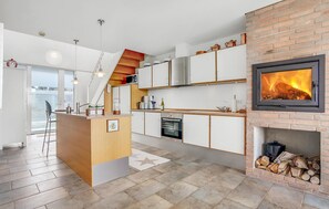 Fridge, stovetop, dishwasher, coffee/tea maker