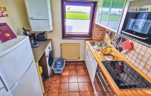 Fridge, stovetop, dishwasher, coffee/tea maker