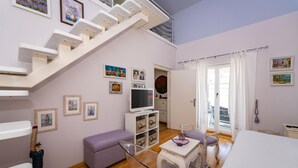 A bedroom with a bed, a desk, a chair, a television, and a staircase. - Stunning home in Sv.Filip i Jakov (Sv.Filip i Jakov)