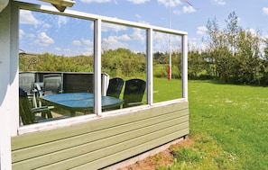 Relax on the deck with a round table and comfortable seating.