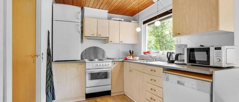 Fridge, stovetop, dishwasher, coffee/tea maker