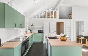 Fridge, stovetop, dishwasher, coffee/tea maker