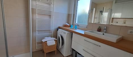 Shower, hair dryer, towels