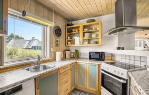 Fridge, stovetop, dishwasher, coffee/tea maker