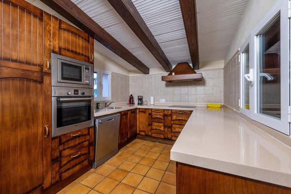 Fridge, stovetop, dishwasher, coffee/tea maker