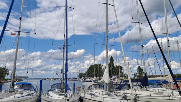 A marina with several sailboats docked. - Old fisherman's house, Germany (Mönkebude)