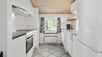 Fridge, stovetop, dishwasher, coffee/tea maker