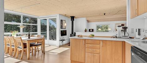 Fridge, stovetop, dishwasher, coffee/tea maker