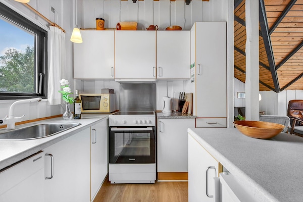 Fridge, stovetop, dishwasher, coffee/tea maker