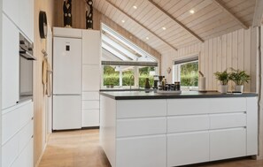 Fridge, stovetop, dishwasher, coffee/tea maker