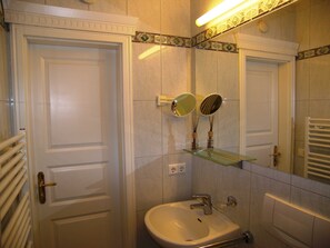 Shower, hair dryer, towels, toilet paper