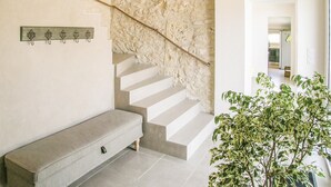 A staircase with a stone wall, a bench, and a plant. - Gorgeous home in St.Aubin de Cadelech (St.Aubin de Cadeleche)