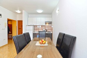 Fridge, stovetop, coffee/tea maker, cookware/dishes/utensils