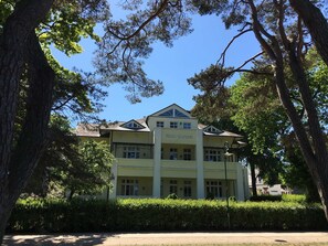 A two-story building with a sign reading 'VILLA CAPRIVI.'