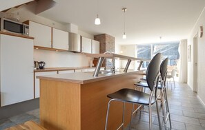 Fridge, stovetop, dishwasher, coffee/tea maker