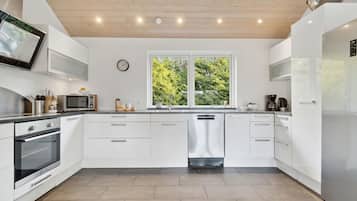 Fridge, stovetop, dishwasher, coffee/tea maker