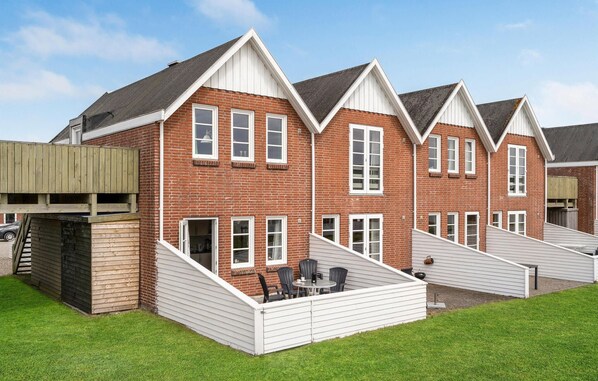 Houses with front porches and shared driveway offer a family-friendly atmosphere.