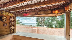 A cafe bistro with a view of the sea, featuring a wooden interior, lifebuoy decorations, and a sign indicating its location. - Awesome home in Altea (Altea)