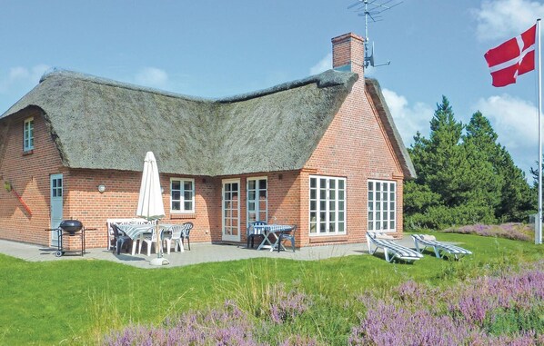 Guests can enjoy outdoor dining and relaxation on the patio and lawn.