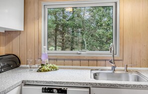 Fridge, stovetop, dishwasher, coffee/tea maker