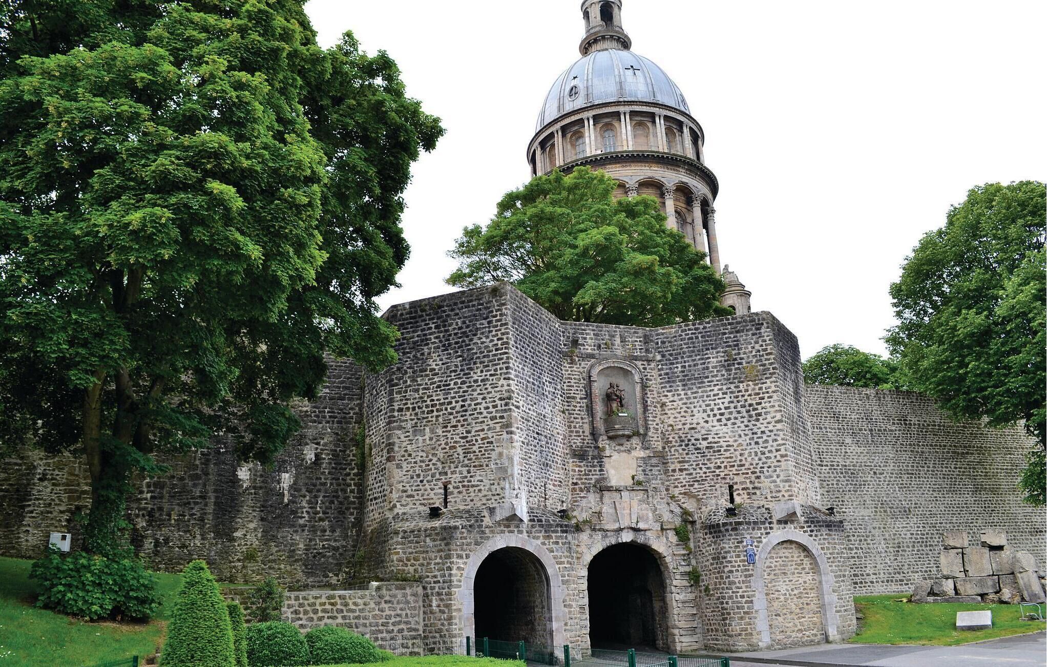A historic building with a prominent dome and stone walls.