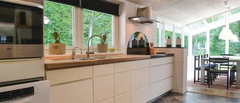 Fridge, stovetop, dishwasher, coffee/tea maker