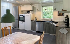 Fridge, stovetop, dishwasher, coffee/tea maker