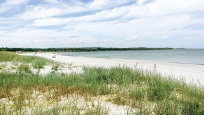 A beach with sand dunes and a calm sea. - Amazing home in Nexø with WiFi (Nexø)