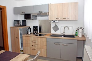 Fridge, microwave, oven, high chair