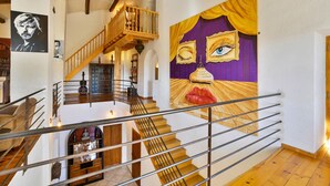 A staircase with a wooden railing leading to a lower level.