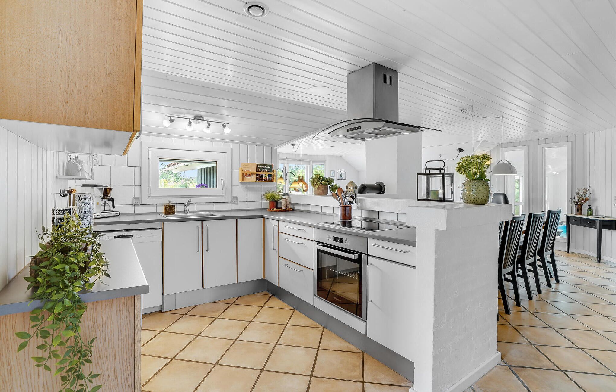 Fridge, stovetop, dishwasher, coffee/tea maker