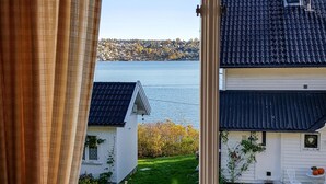 A view of a lake with buildings in the background.