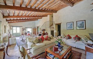 A spacious living room with a high wooden ceiling, a staircase, and a dining area. - Stunning home in Lugnano in Teverina (Lugnano in Teverina)