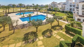 A resort with multiple swimming pools, palm trees, and well-maintained lawns. - Gorgeous apartment in Roldán with WiFi (Roldán)