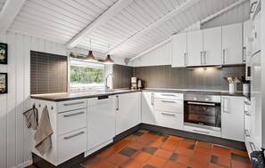 Fridge, stovetop, dishwasher, coffee/tea maker