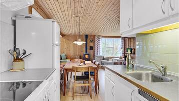 Fridge, stovetop, dishwasher, coffee/tea maker