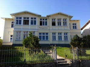 A two-story building named 'Margarete' with a symmetrical facade, large windows, and a central entrance.