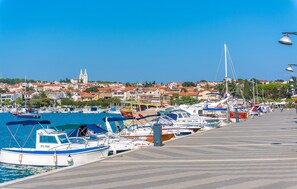 Stunning marina views of the adjacent town with a historic church in the background.