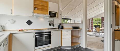 Fridge, stovetop, dishwasher, coffee/tea maker