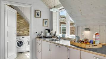 Fridge, stovetop, dishwasher, coffee/tea maker