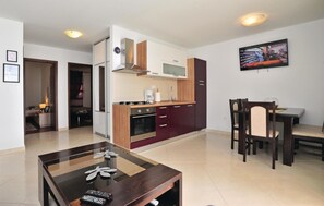 Fridge, stovetop, dishwasher, coffee/tea maker