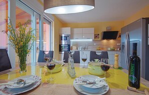 Enjoy a romantic dinner for two in this stylish dining area, complete with a kitchen and TV.